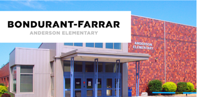 Bondurant-Farrar Anderson Elementary building entrance with blue doors and red brick exterior