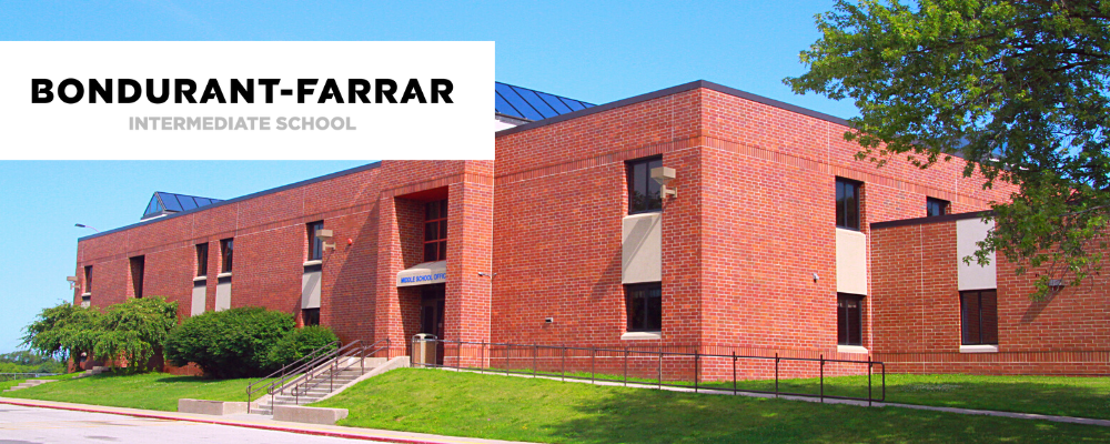 Bondurant-Farrar Intermediate School brick building with a lawn and blue sky
