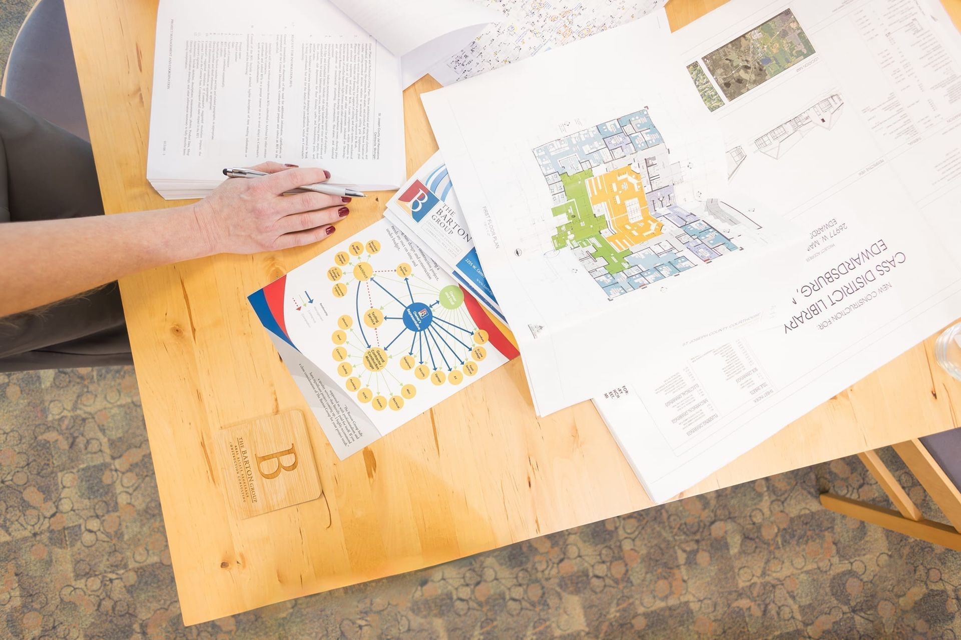 Project drawings and floor plans being reviewed at a work table