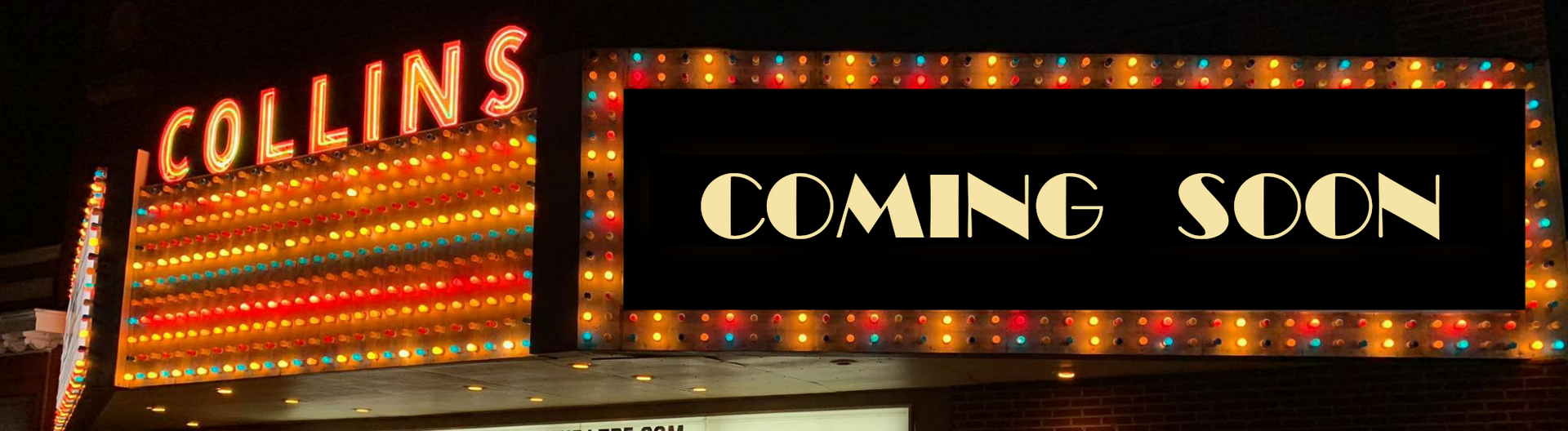 The Collins theater marquee lit up with “COMING SOON” in orange and white neon.