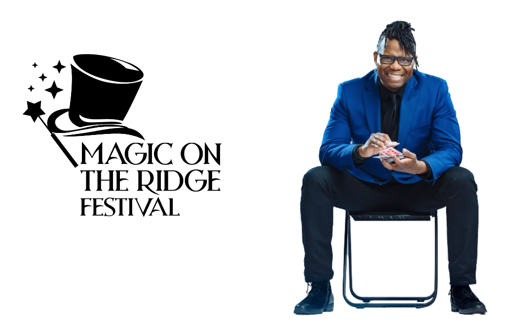 Magic on the Ridge Festival logo beside a smiling man in a blue suit seated on a stool