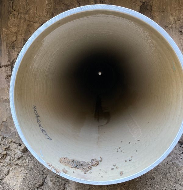 The inside of a pipe that says ' asphalt ' on it