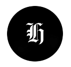 Black circle with a white ornate letter 