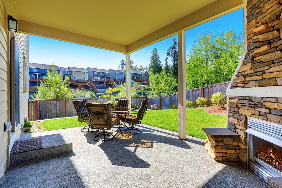 Newly constructed patio with table and fireplace
