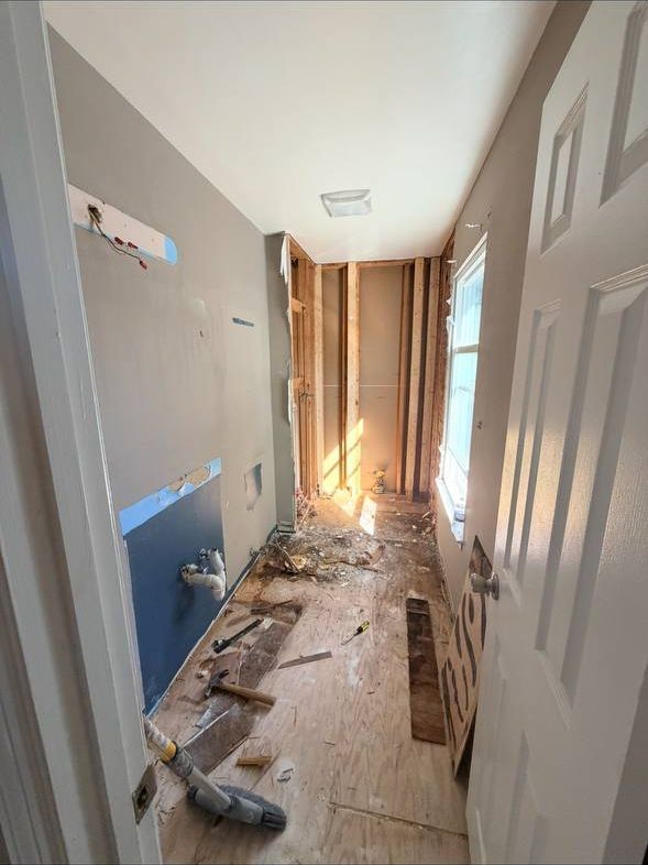 Elkridge bathroom remodel during demolition, shower removed down to the studs