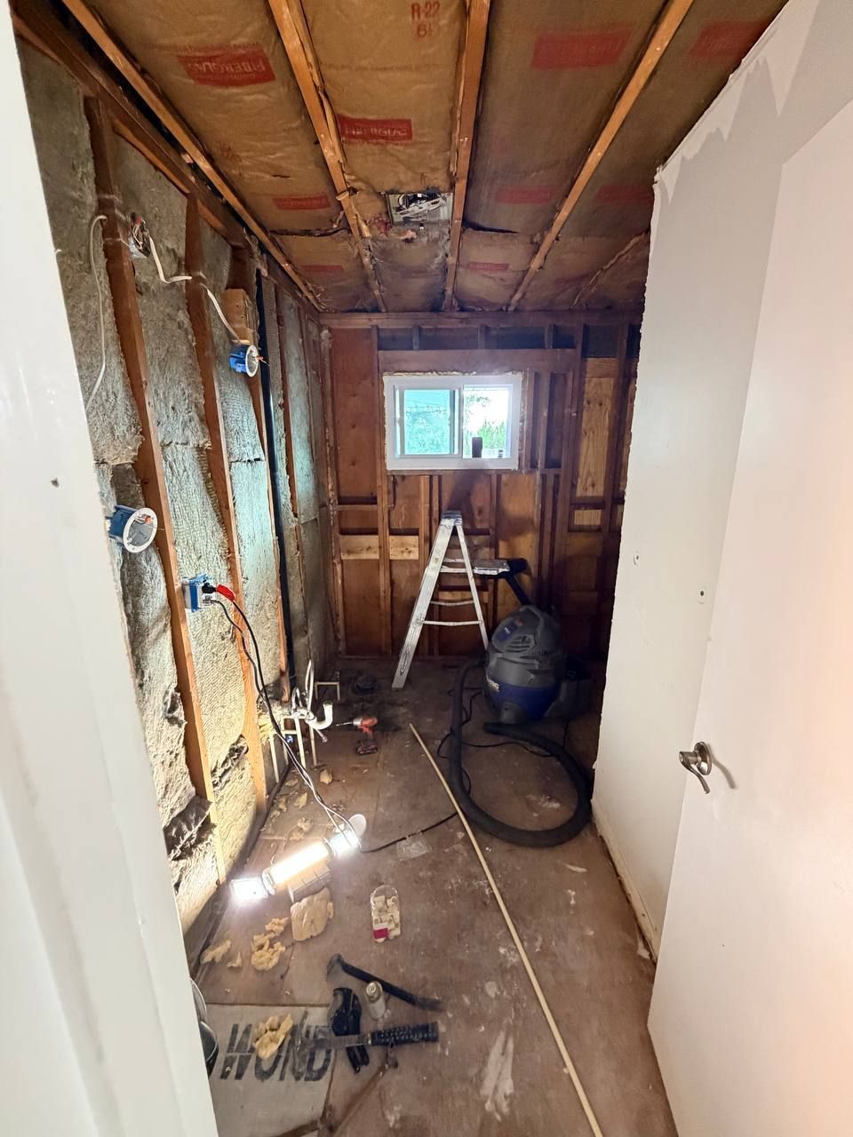 Westminster, MD bathroom remodel during demolition, walls open to the studs with new electrical boxes