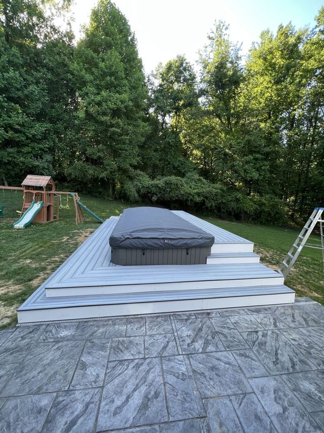Finished composite platform and patio around a hot tub, a Handyman on Demand project