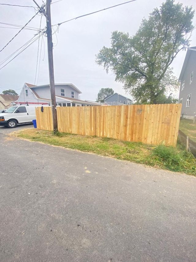 New wood privacy fence along a side yard, a Handyman on Demand project