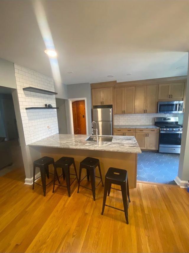 Kitchen remodel with island and bar seating