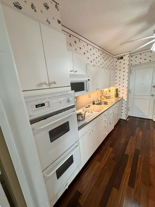 White kitchen with wall ovens - Handyman on Demand