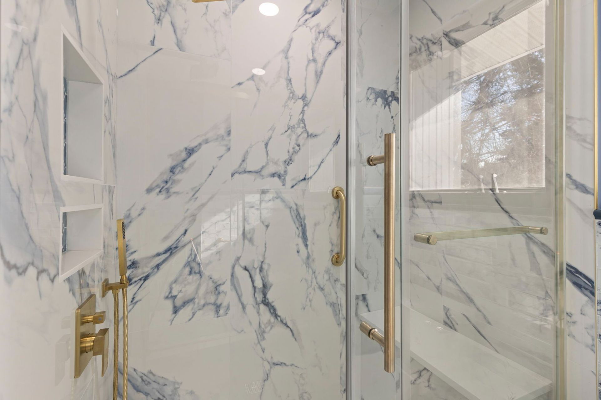 Marble walk-in shower remodel by a licensed Maryland contractor