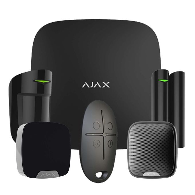 Componenti del sistema di sicurezza domestica Ajax su un hub nero, inclusi sensori e telecomando.