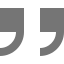 A pair of gray quotation marks on a white background.