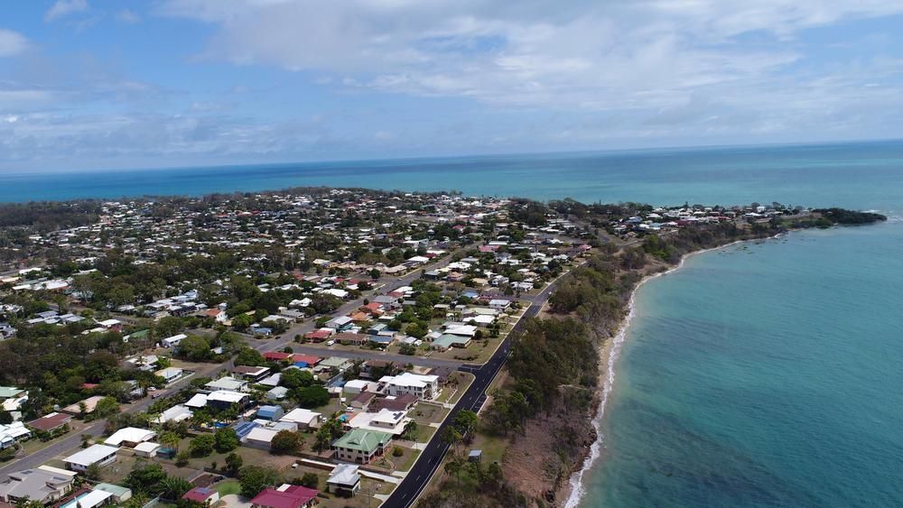 An Aerial View Of A Small Town Next To A Body Of Water — Hervey Bay Outboards In Urangan, QLD