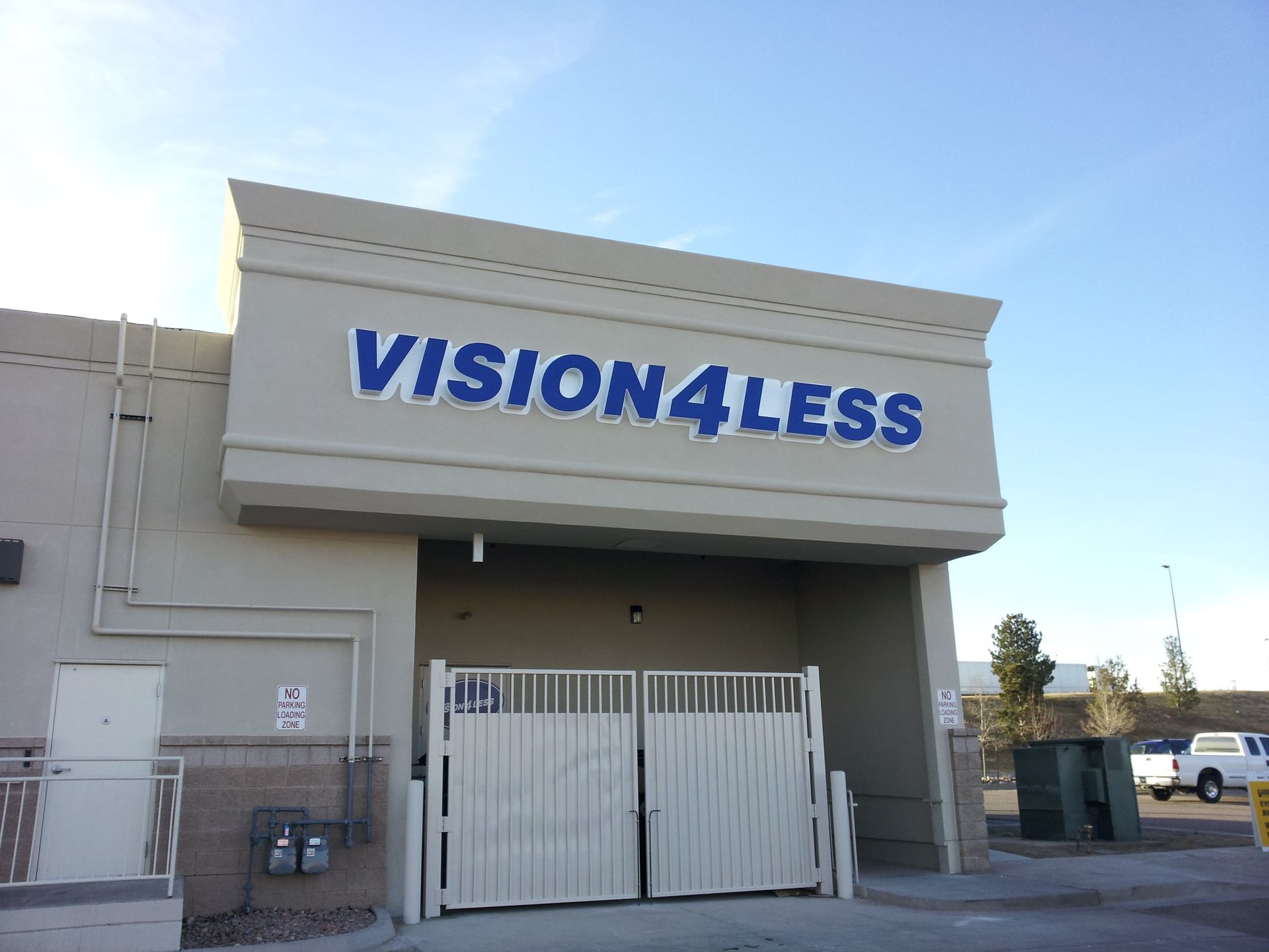 A building with a sign that says vision4less