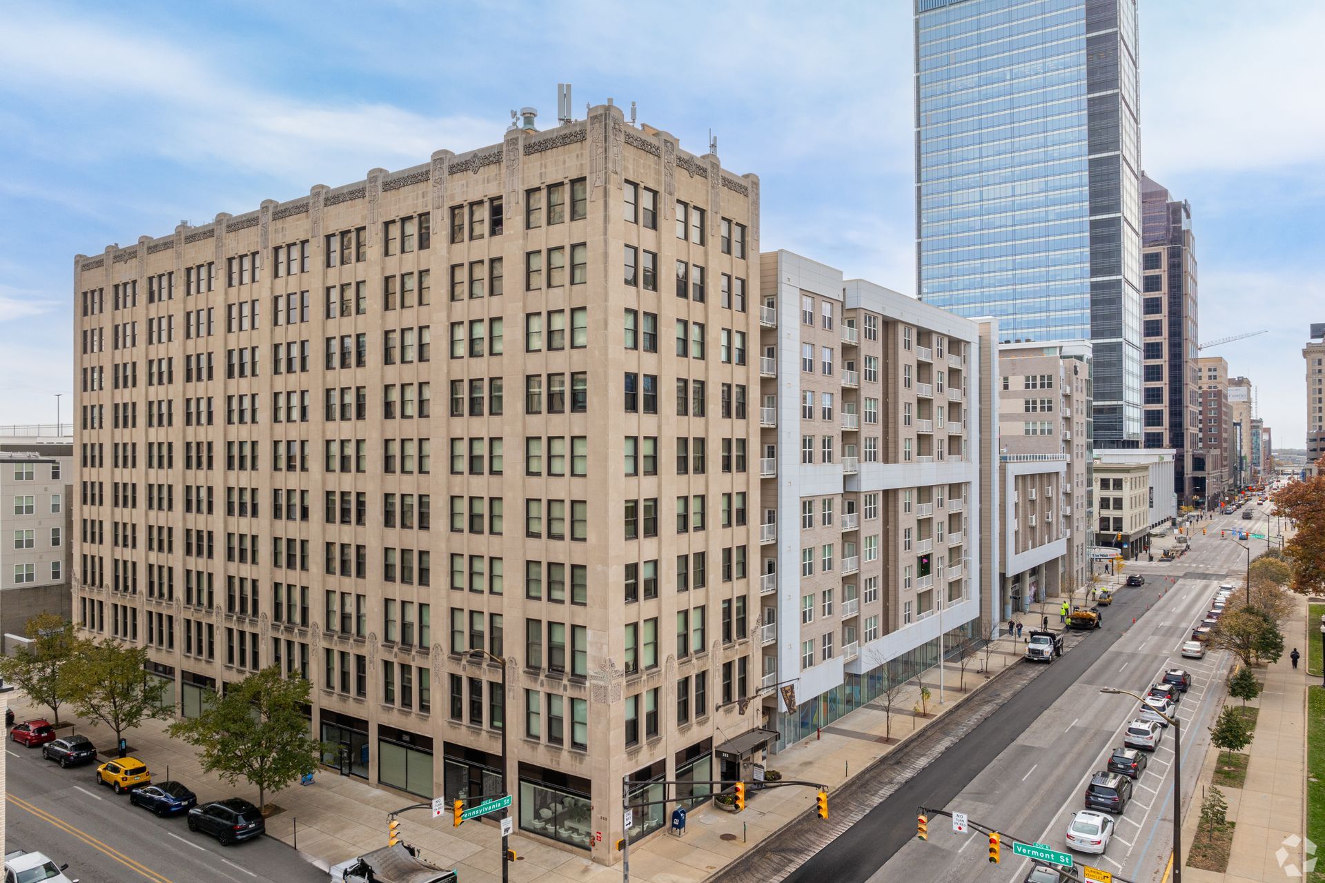 An aerial view of a large building in the middle of a city.