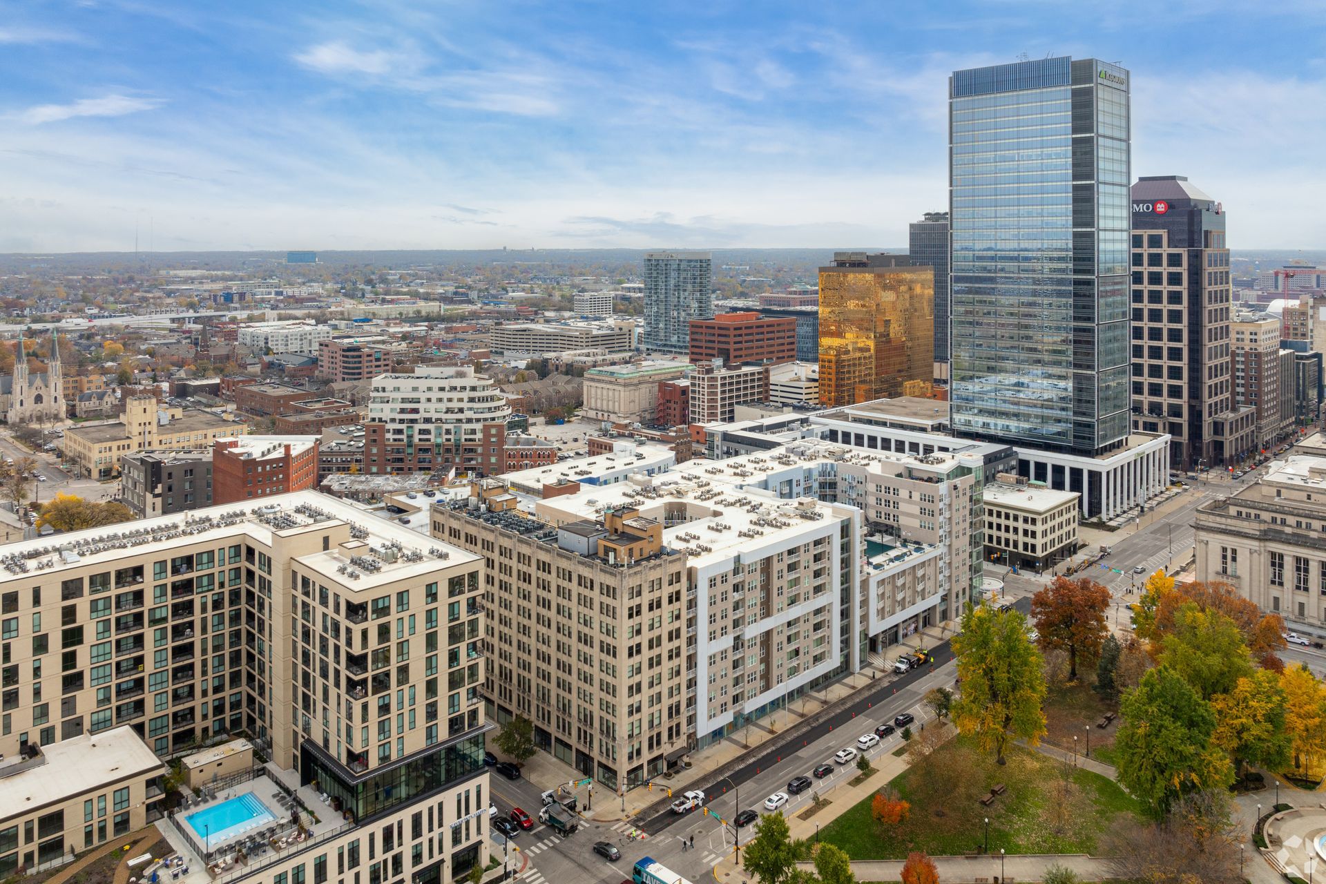 An aerial view of a city with lots of buildings and trees.