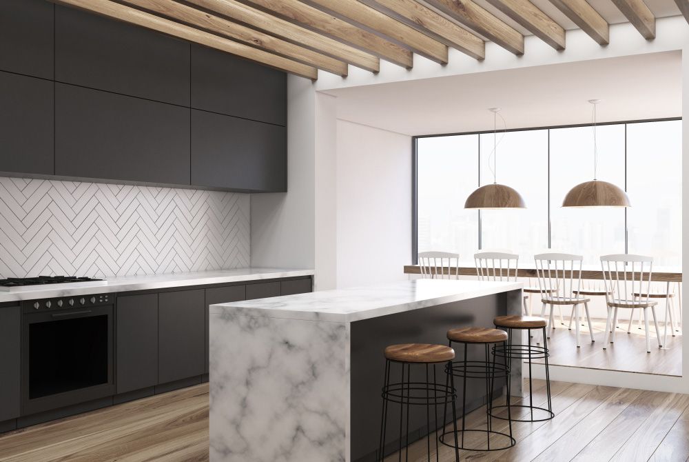 A Kitchen With A Marble Counter Top And Stools — Universal Marble & Granite In Woolgoolga, NSW