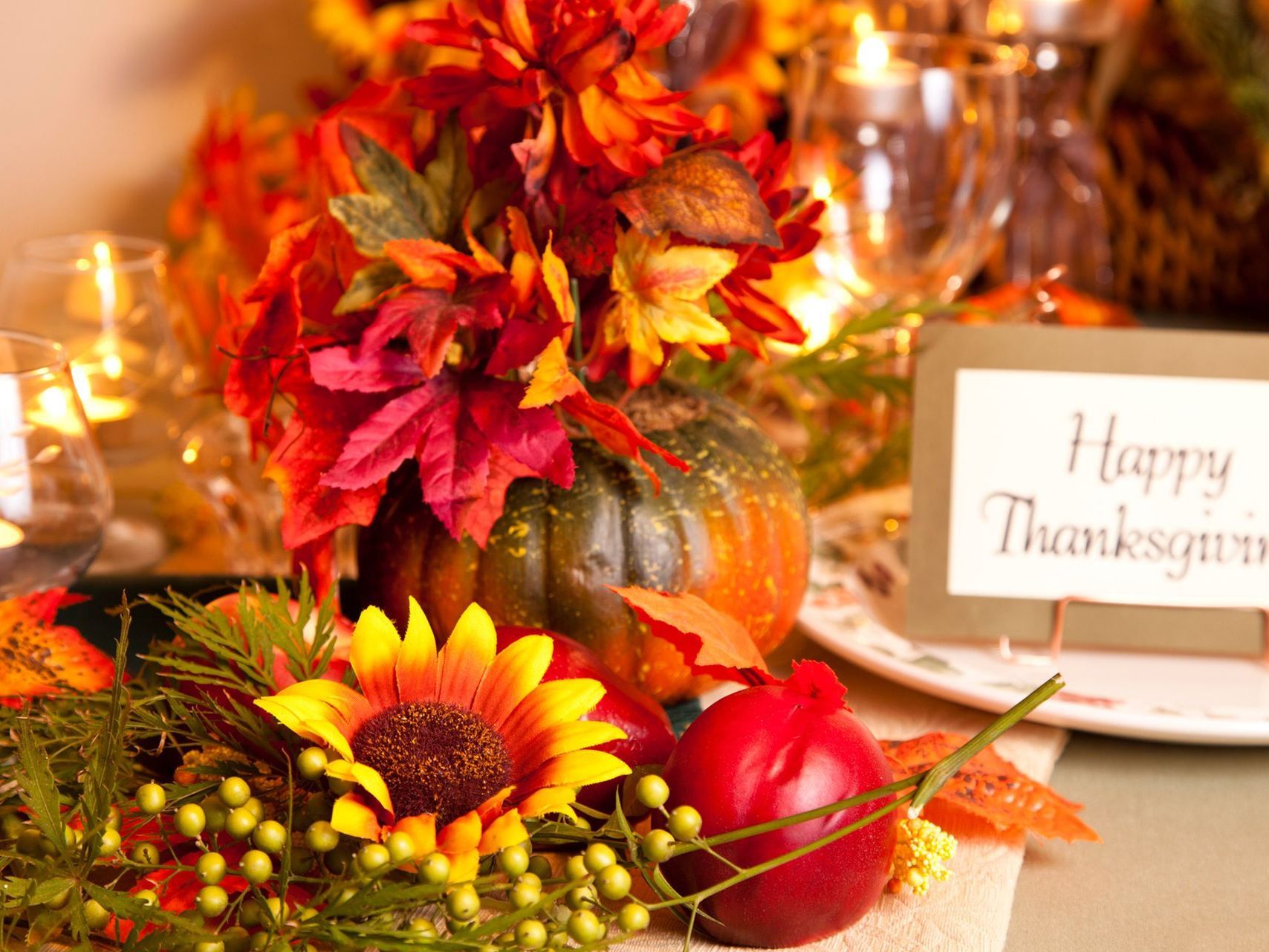 There is a sign that says ''Happy Thanksgiving'' on the table.