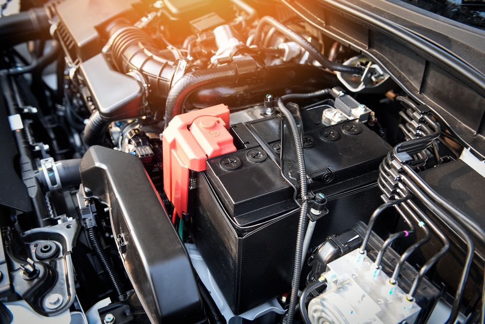 A Close Up of a Car Engine With a Battery in It — JJ's Garage In South Geelong, VIC