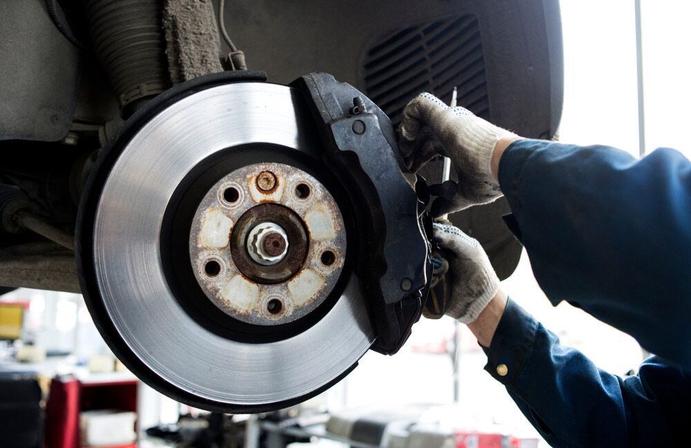 A Man is Fixing a Brake Disc on a Car — JJ's Garage In South Geelong, VIC