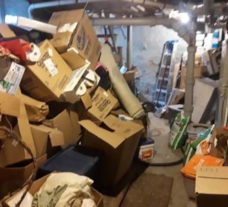 A bunch of cardboard boxes are stacked on top of each other
