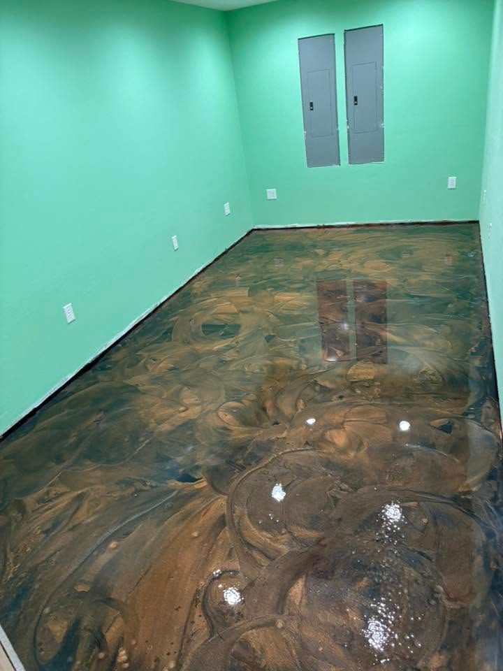 Mint-green room with polished dark stone floor and two gray closet doors at the back.