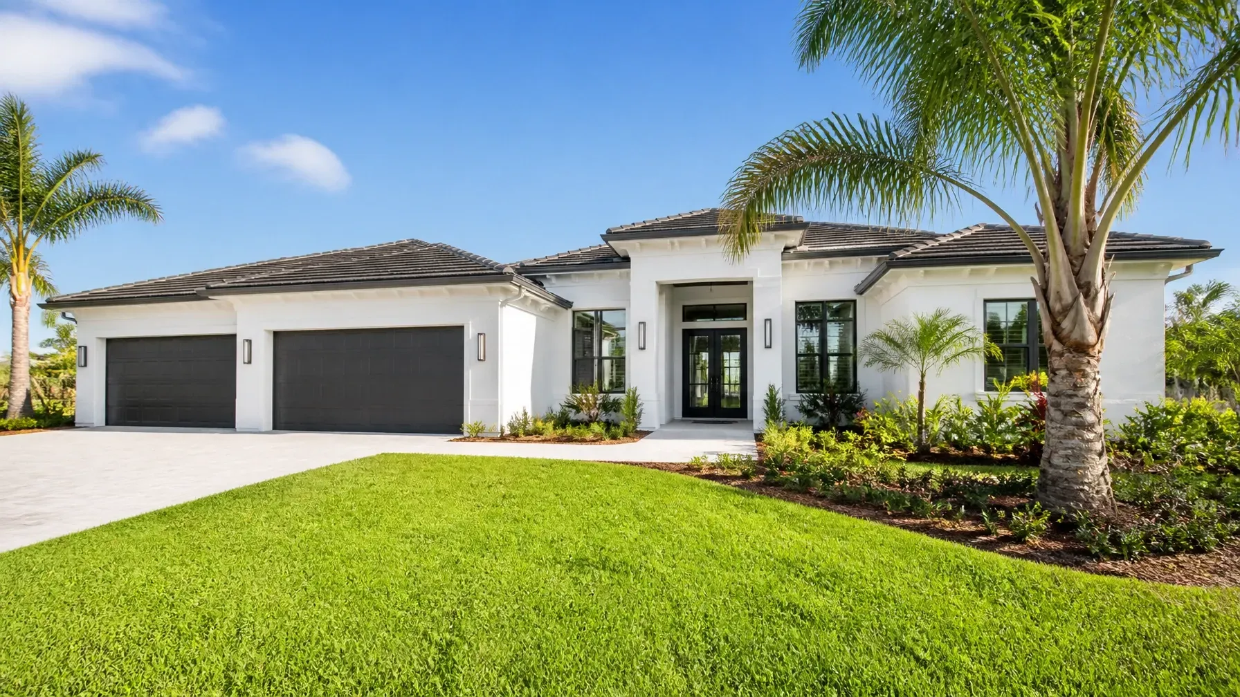Modern Florida home with palm trees and a bright lawn, illustrating professional Florida flood