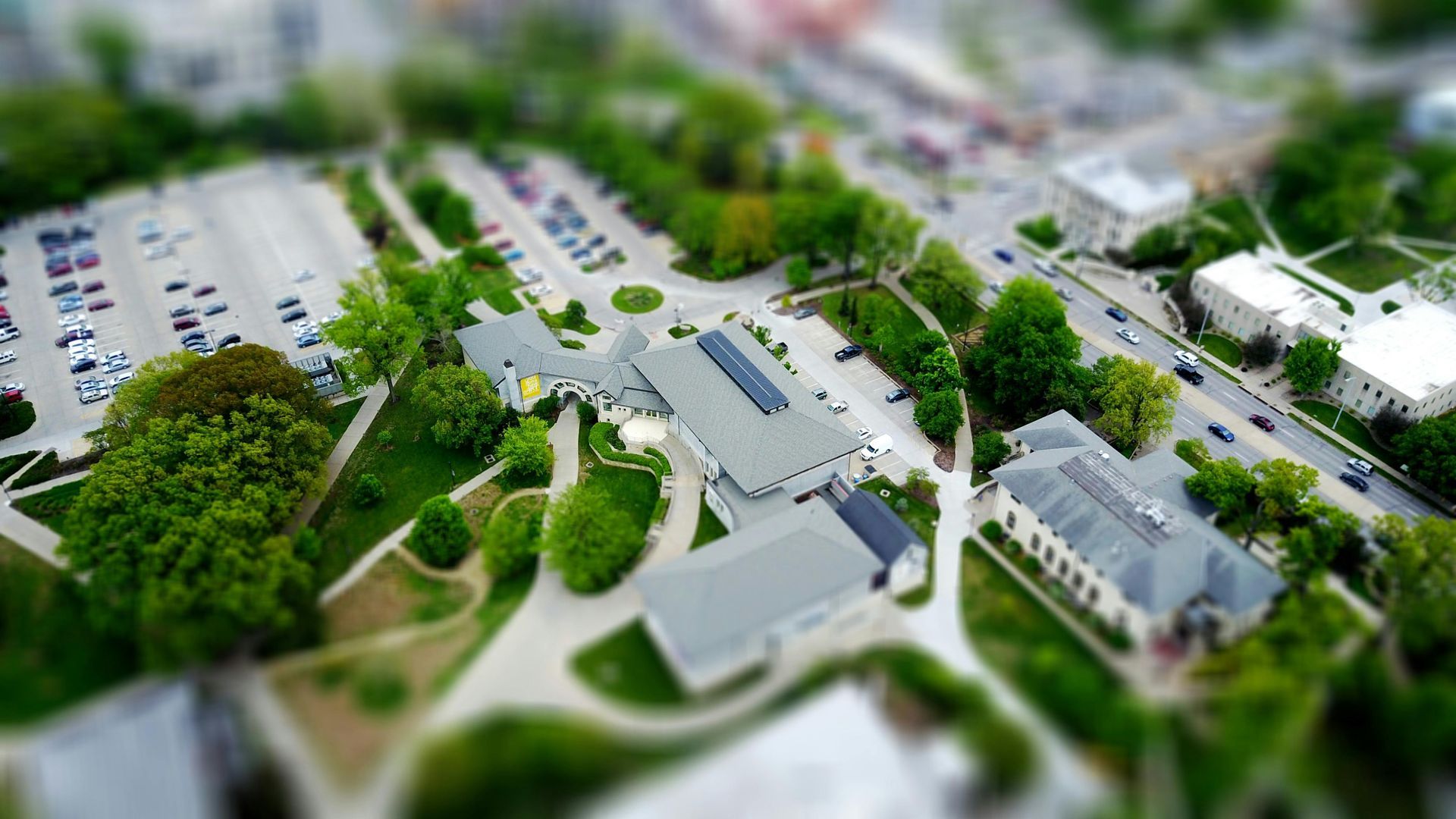 An aerial view of a city with lots of buildings and trees.