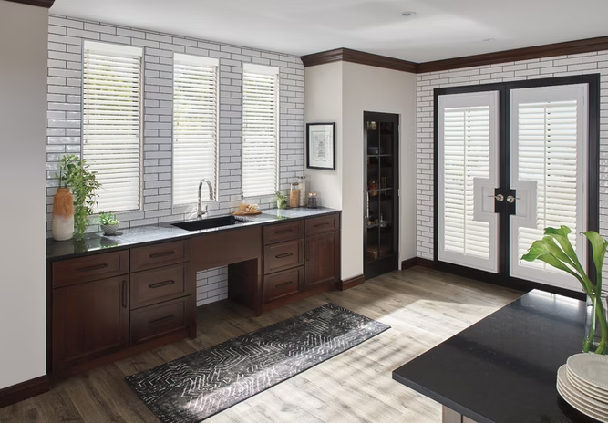 Modern kitchen with dark wood cabinets, white shutters, a large window, and a tiled floor.