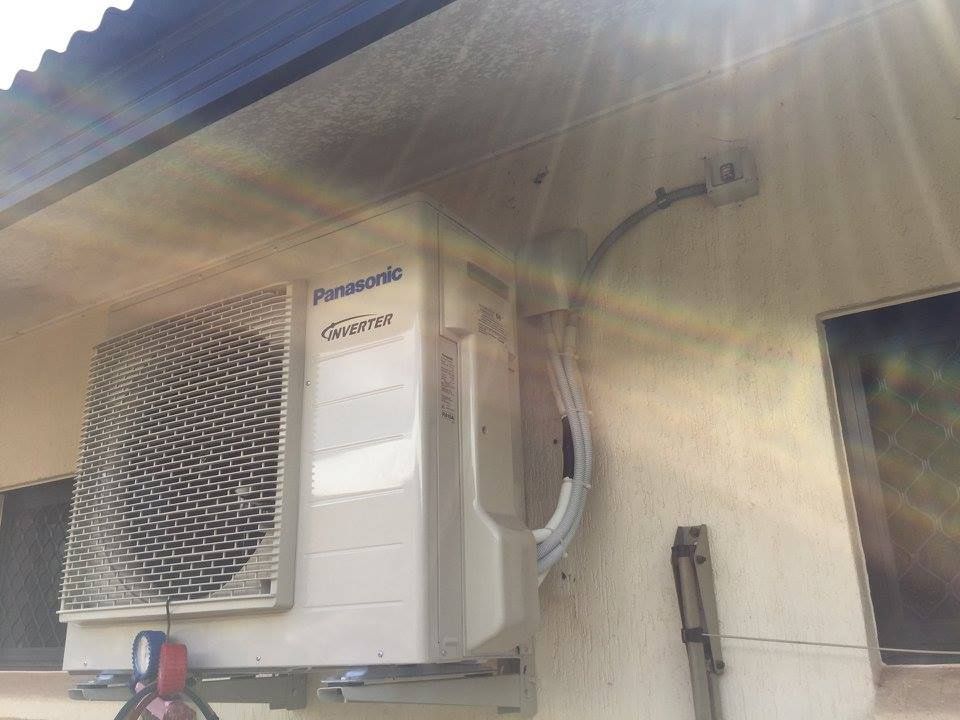 Panasonic Air Conditioner Mounted on a Beige Building — Active Airconz in Mackay, QLD