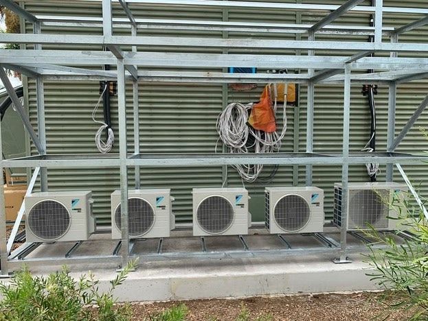Five Air Conditioning Units Mounted on A Metal Frame — Active Airconz in Western Australia Urban, Rural & Remote, QLD