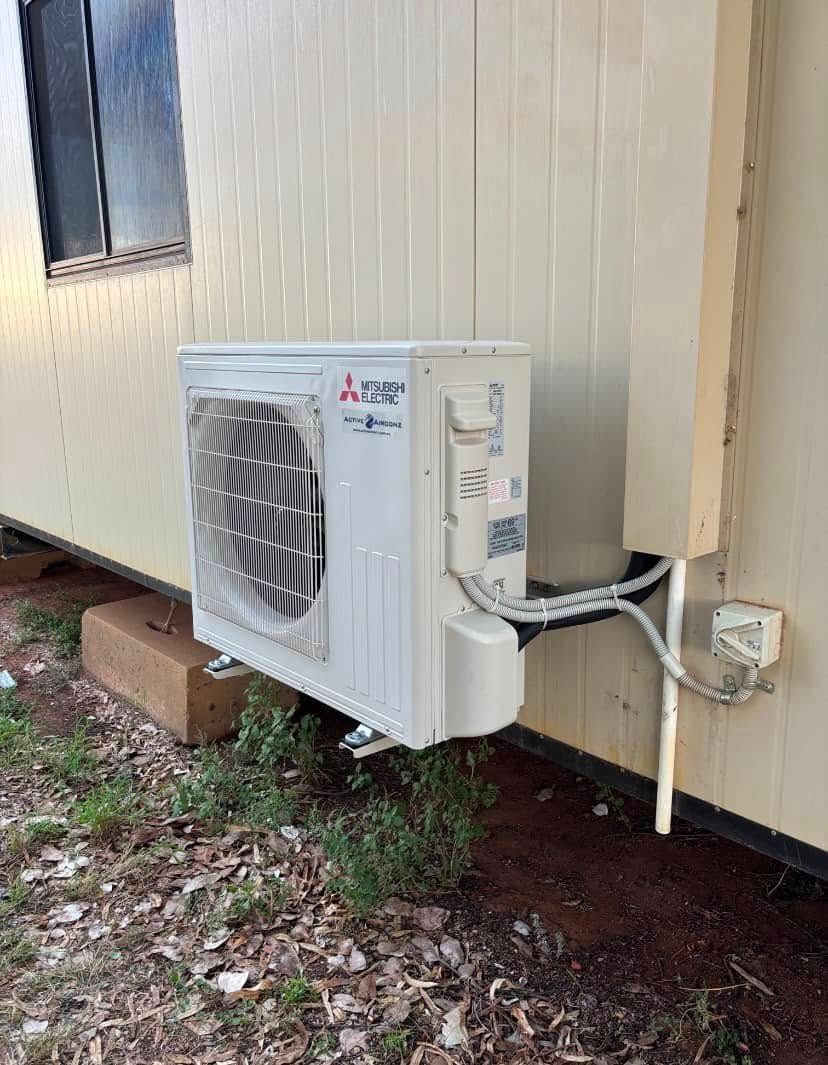 Mitsubishi Air Conditioning Unit Mounted on an Off-white Building — Active Airconz in Gold Coast, QLD