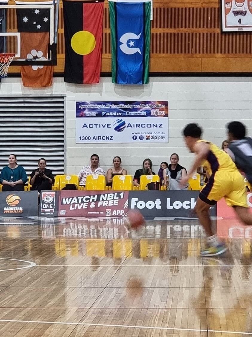 Indoor Basketball Game With Players in Yellow and Dark Uniforms — Active Airconz in Winnellie, NT