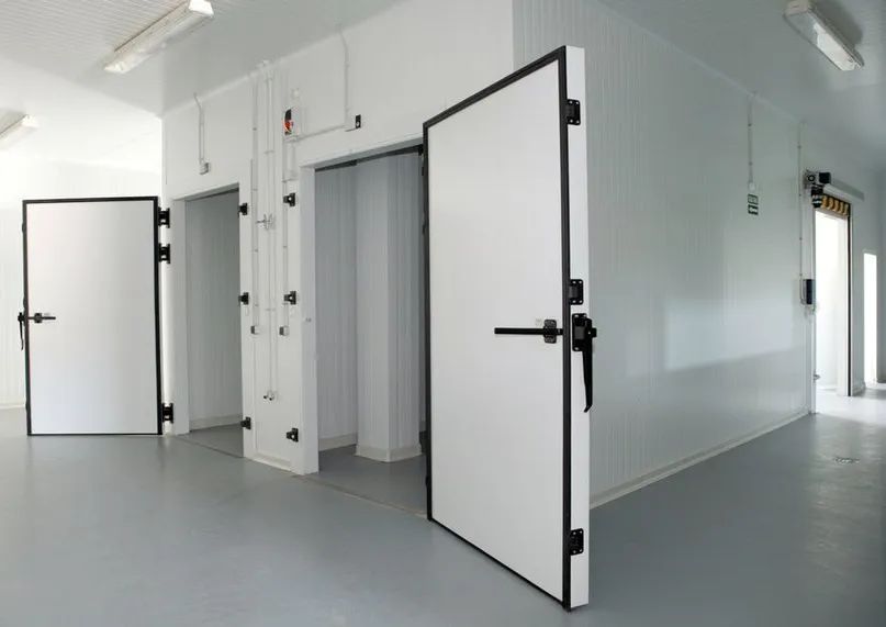 Three White Industrial Doors With Black Frames — Active Airconz in Winnellie, NT