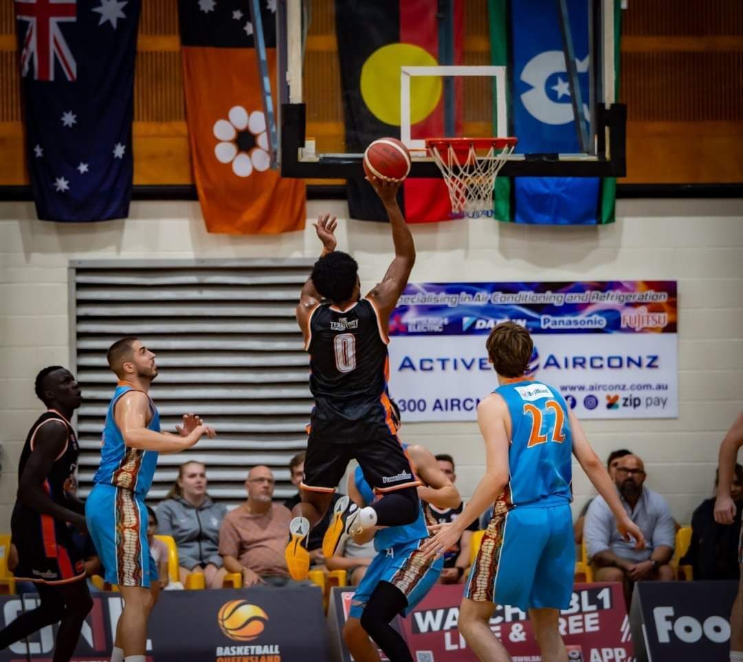 Basketball Player in Black Jumps for a Layup as Defenders — Active Airconz in Winnellie, NT