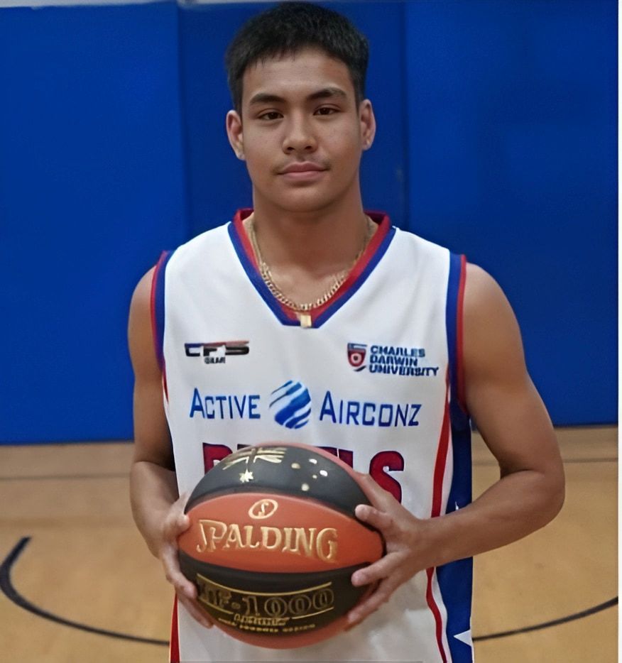 Basketball Player in White Jersey Holding a Spalding Ball — Active Airconz in Winnellie, NT
