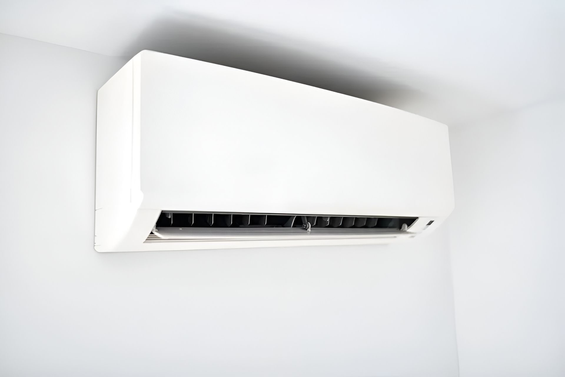 White Wall-mounted Air Conditioning Unit on a White Wall — Active Airconz in Rural & Remote, NT