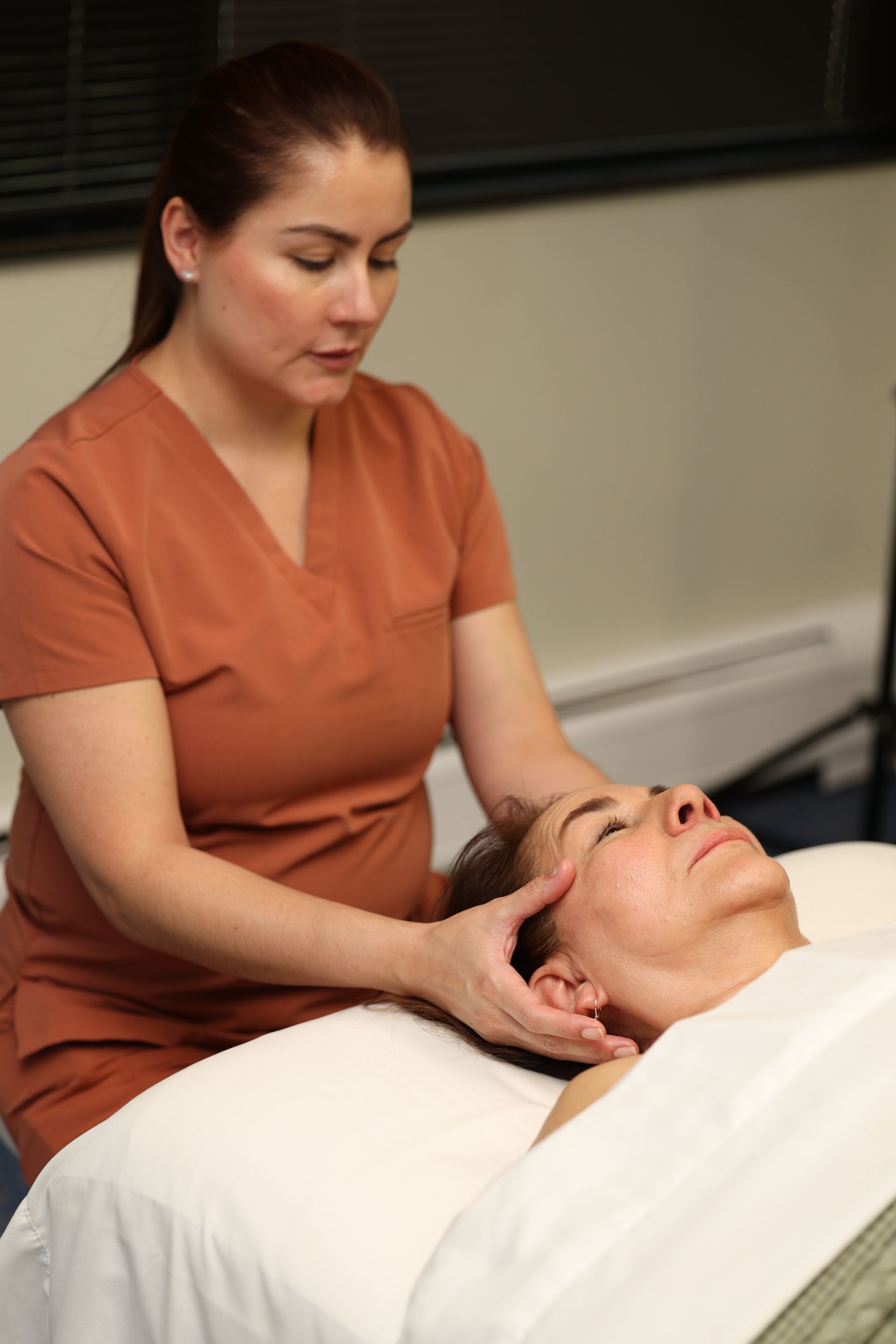Person receiving a head massage in a spa setting
