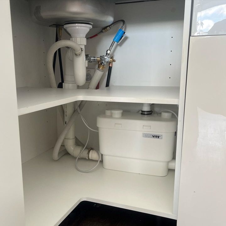 A White Box With the Word Thet on It Sits Under a Sink — T. Woods Plumbing in Bathurst, NSW