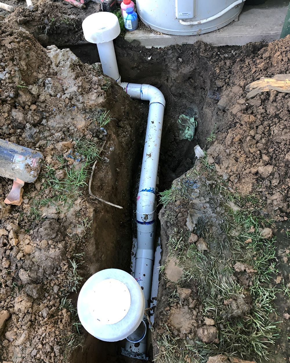 Underground Drainage Pipe In Trench - T. Woods Plumbing