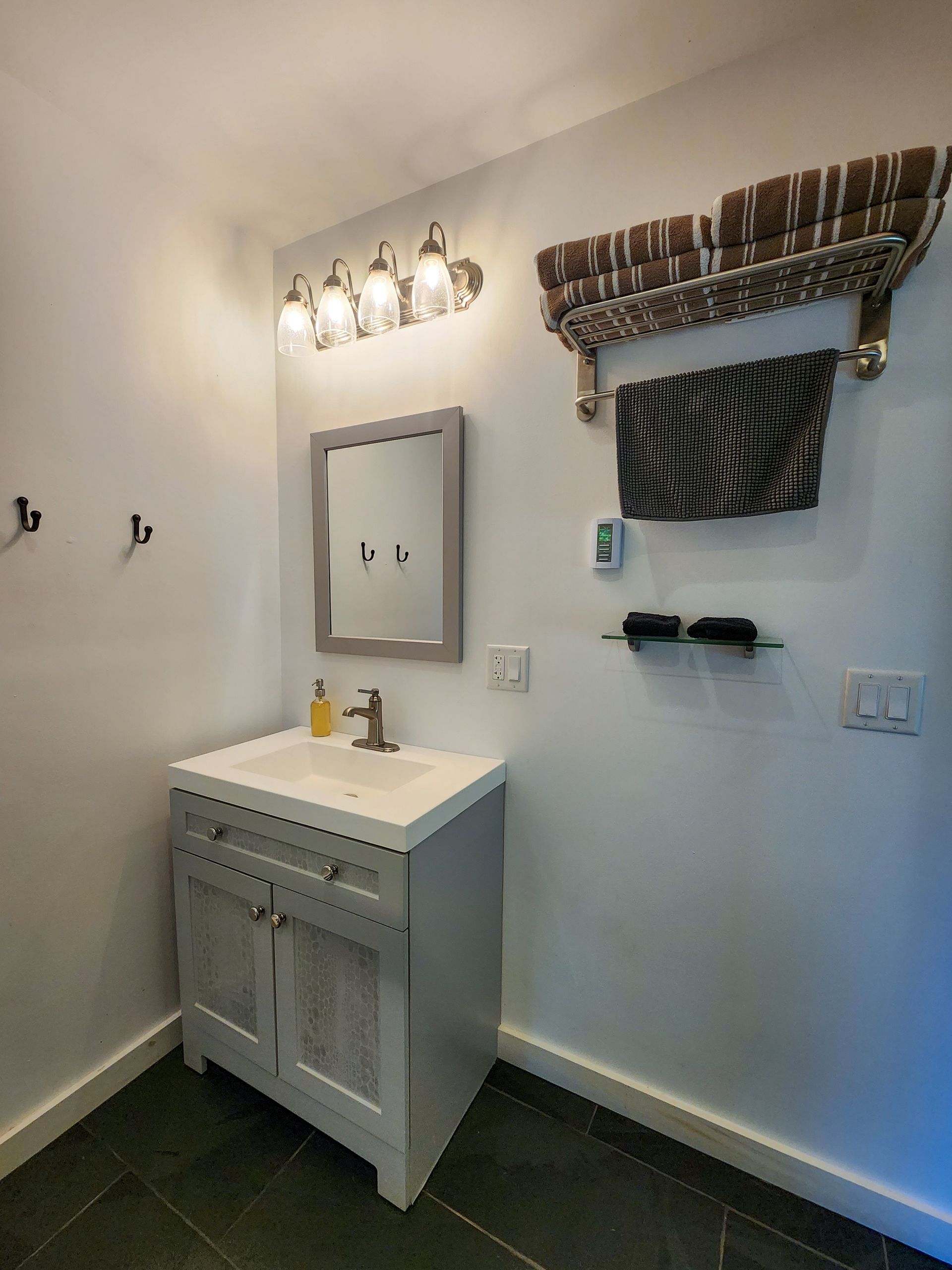 Bathroom of Cabin #1 at Belleayre Lodge, in Pine Hill, NY - showing spacious sink and mirror.