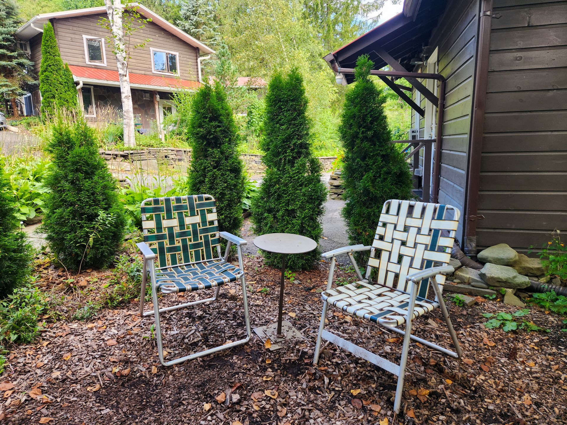 White chairs shown outside of Cabin #2 at Belleayre Lodge in Pine Hill section of Catskills region.
