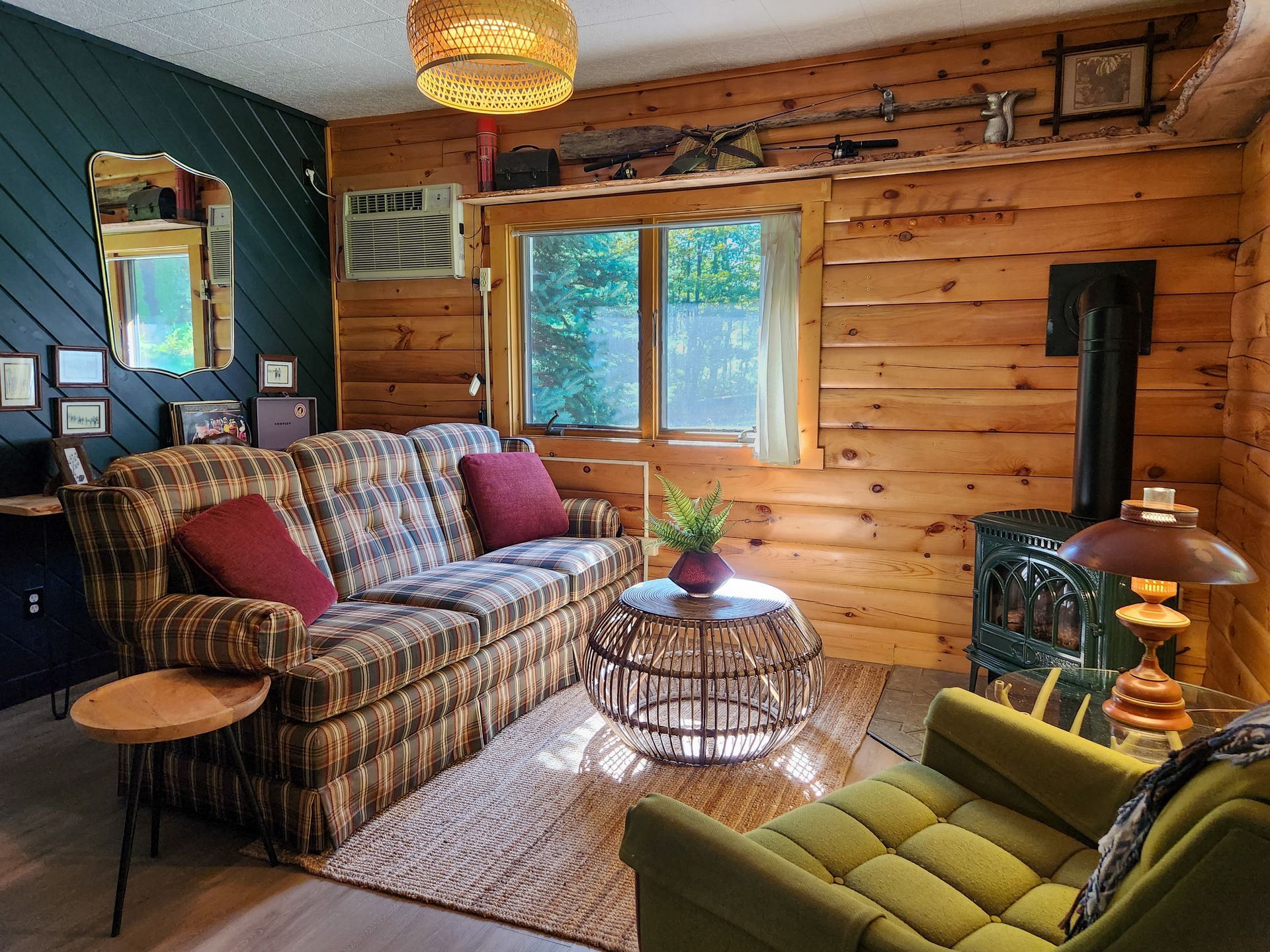 Cozy living room of Cabin #4A at Belleayre Lodge, showing sofas and fireplace.