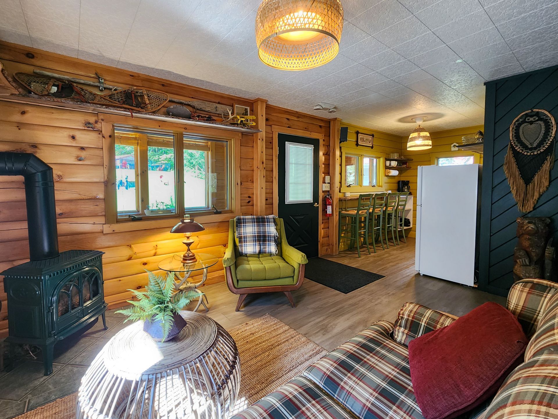 Cozy living room of Cabin #4A at Belleayre Lodge, showing sofas and fireplace.
