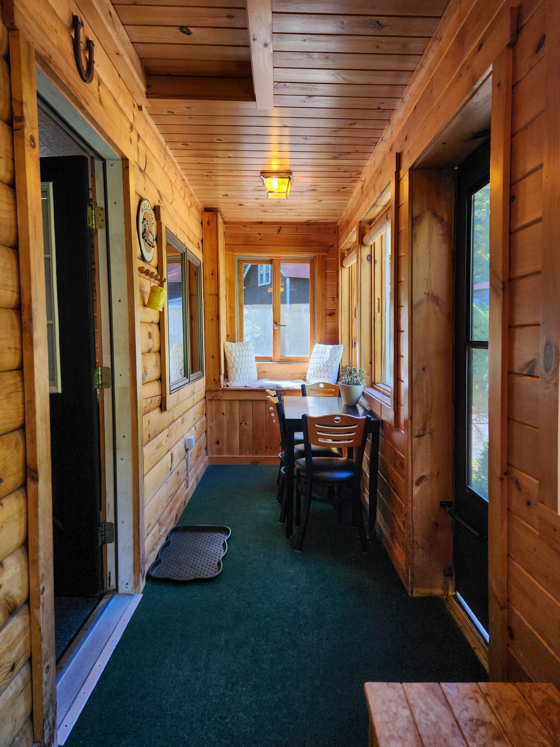 Cozy porch of Belleayre Lodge's Cabin #4A. Beautiful views of Catskills outside windows.