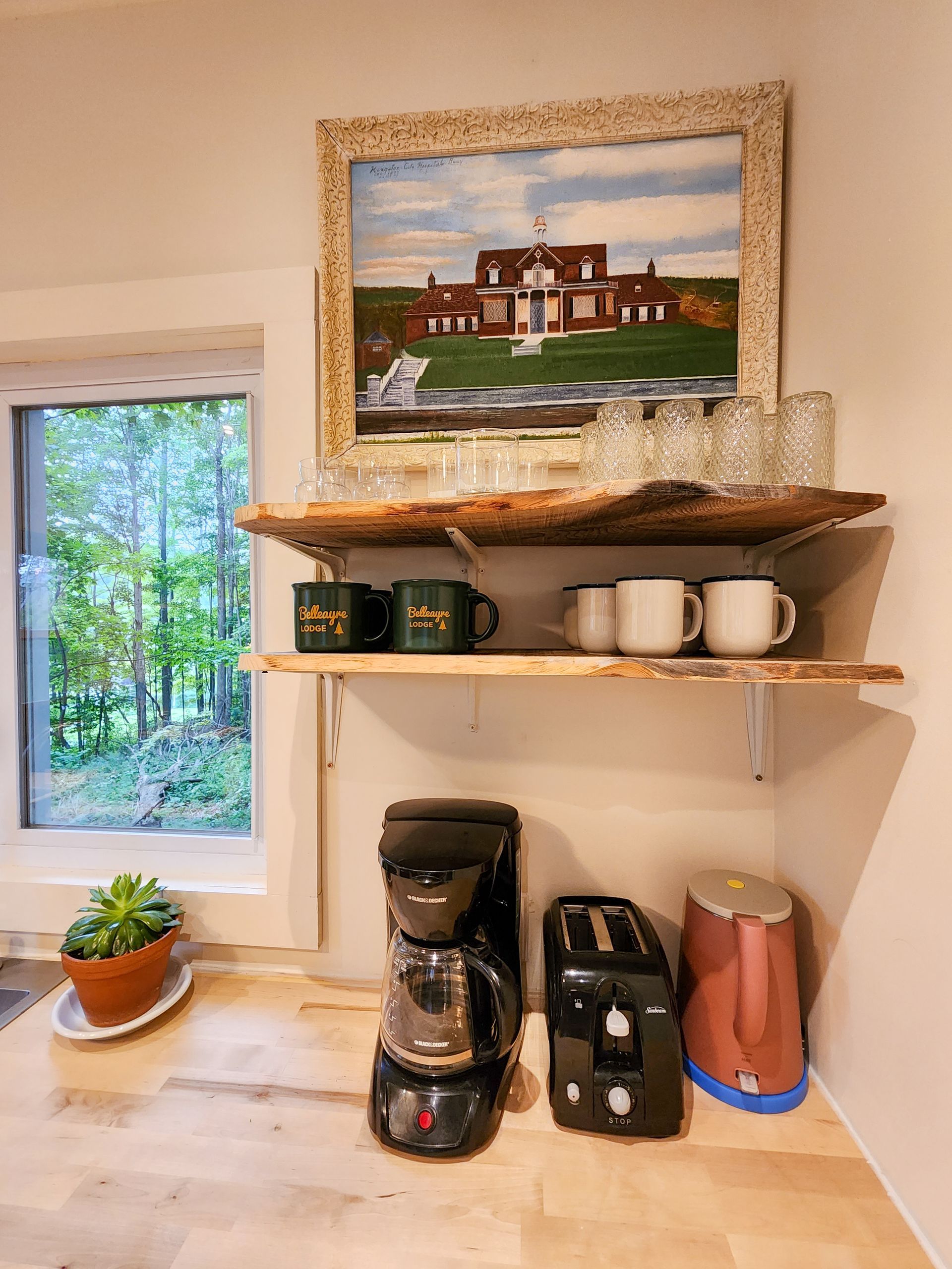Shelf with branded mugs and beautiful views out window at Belleayre Lodge - Cabin #9