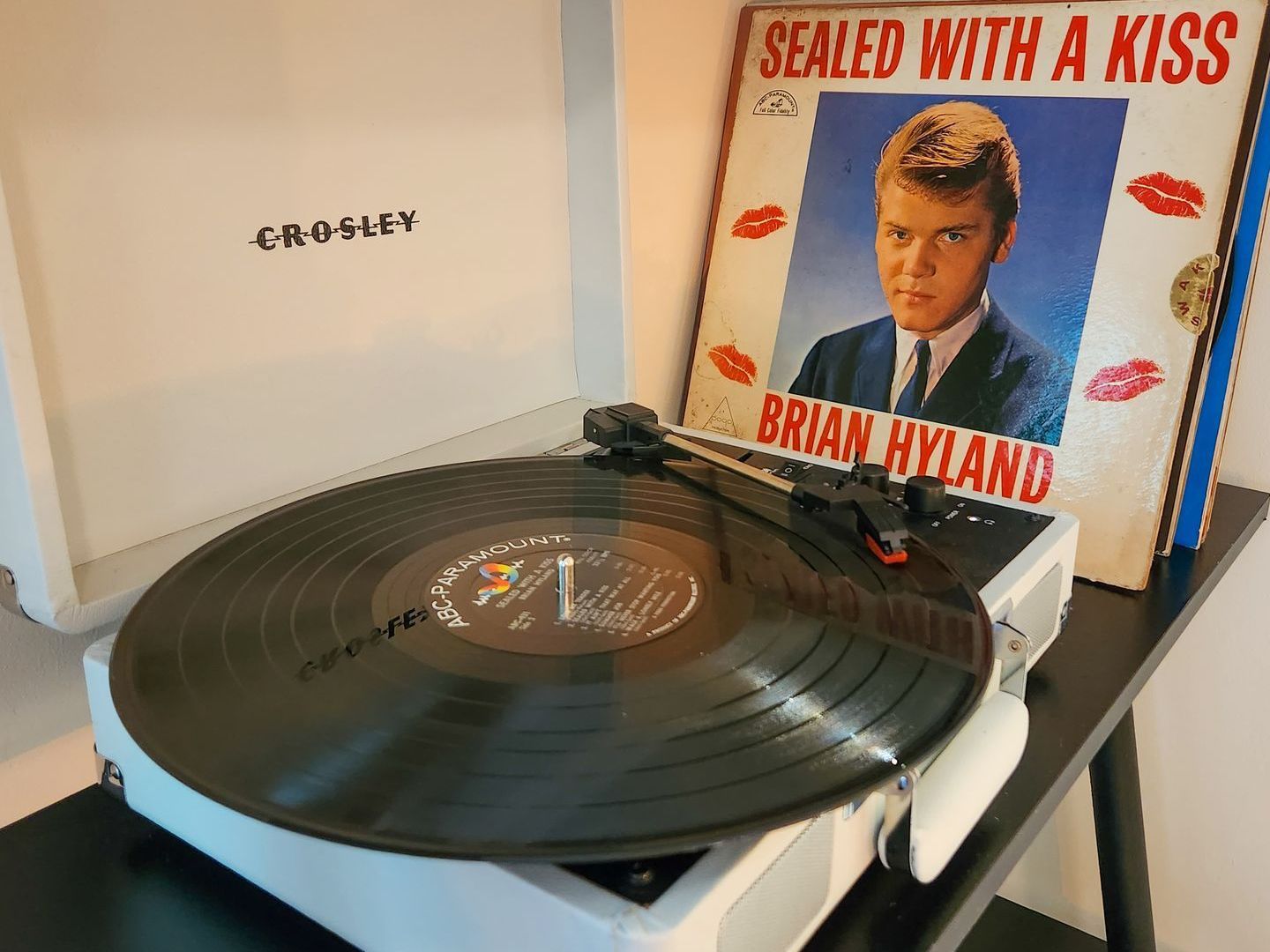 Closeup of one of Belleayre Lodge's cabin amenities: Crosley vintage-style turntable with a vinyl record inside.