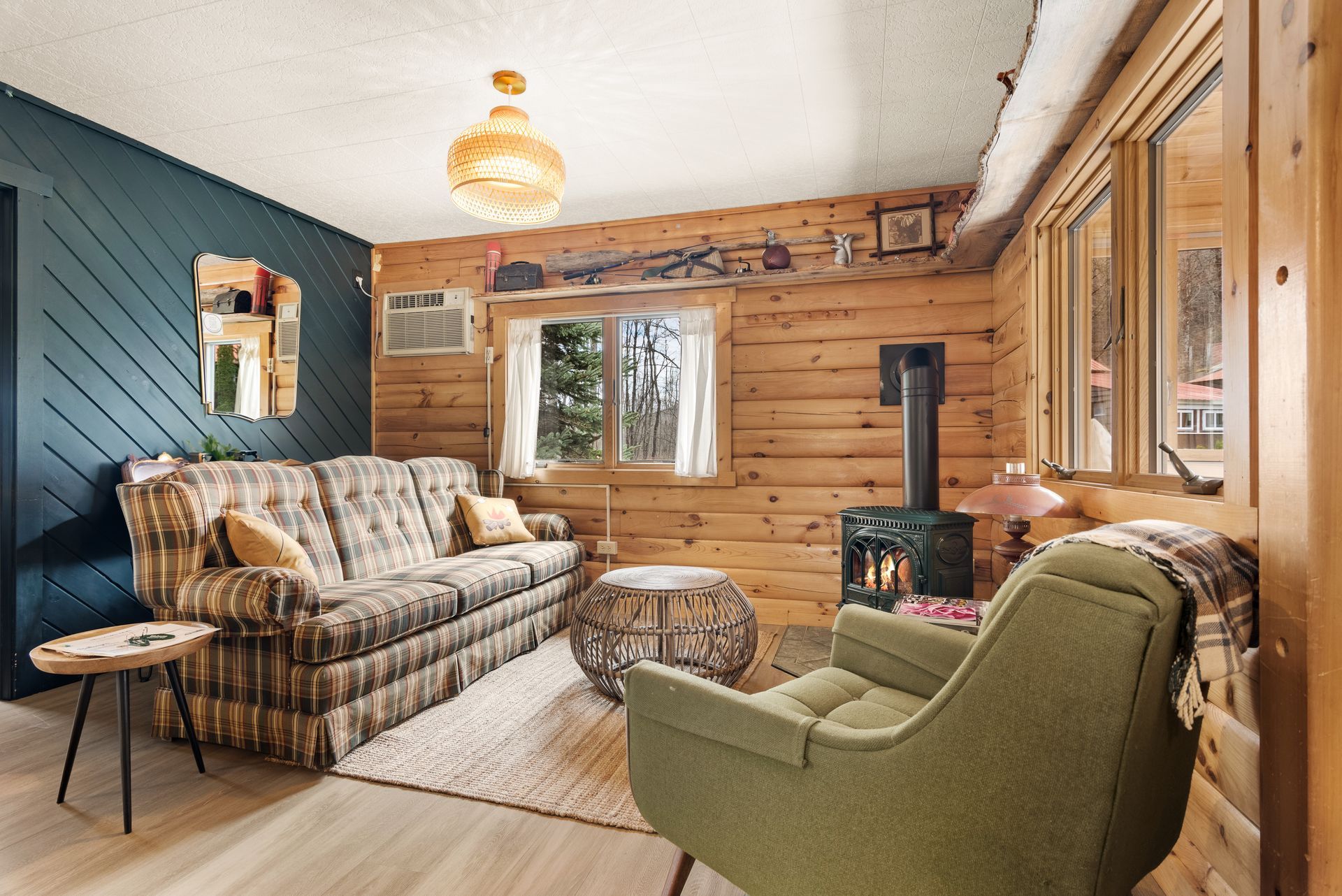 Cozy bedroom for Cabin 4A in Belleayre Lodge in Pine Hill, NY - showing furniture, fireplace, and Catskill views