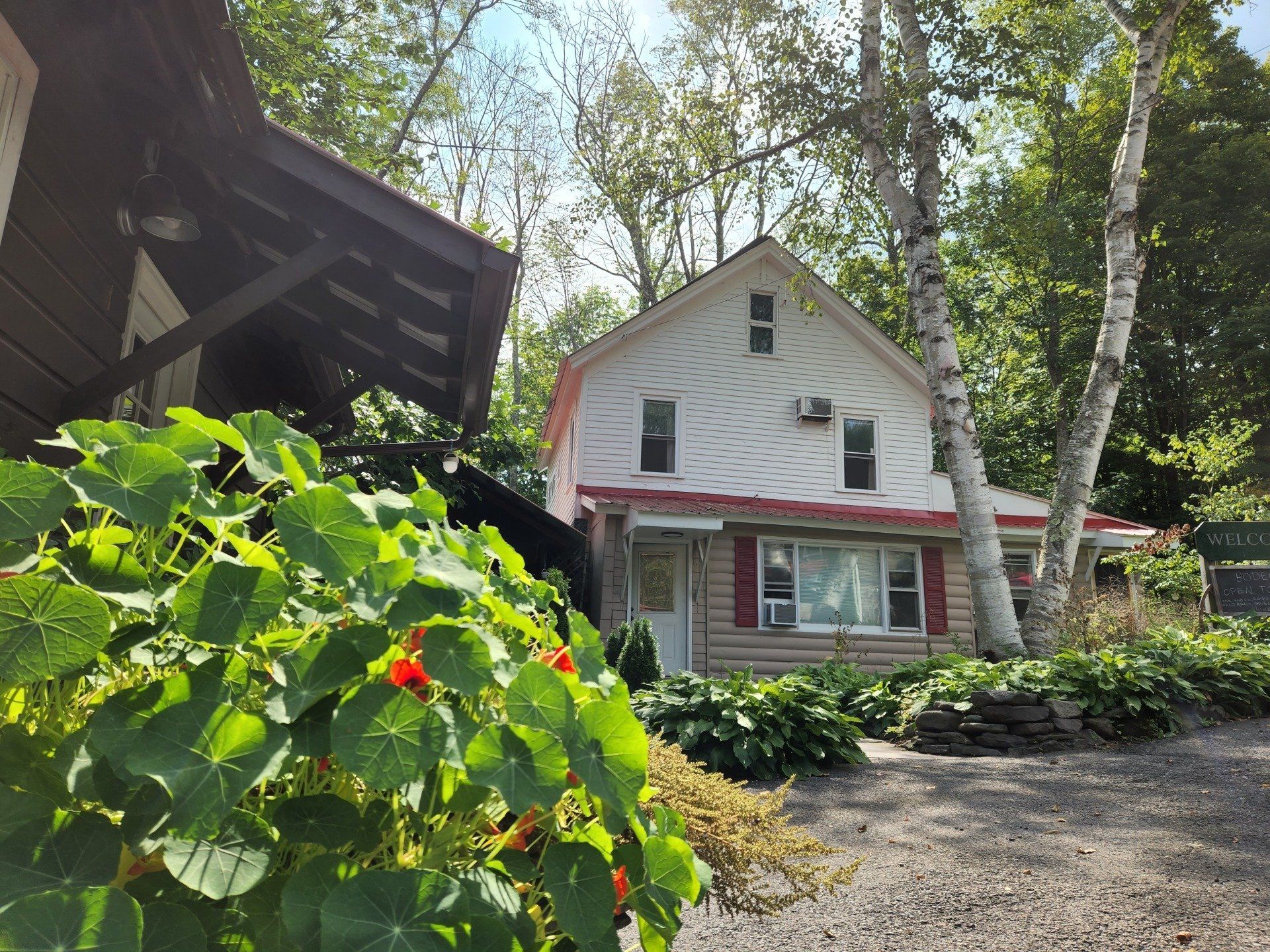 Exterior of Cabin #227 at Belleayre Lodge, showing beautiful foliage in Pine Hill, New York.